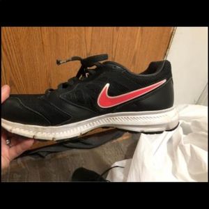 Pink and black Nike shoes